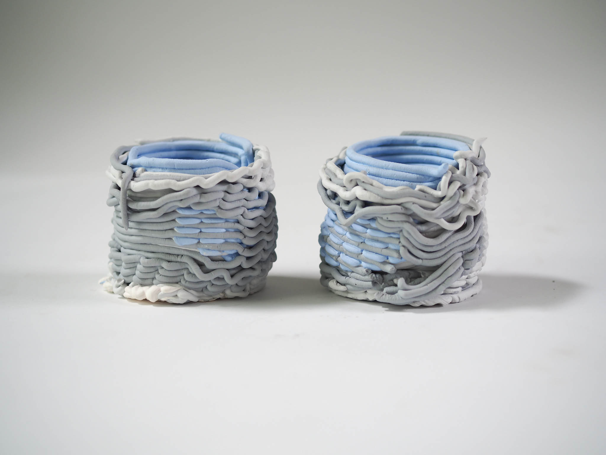 collection of woven ceramic vases